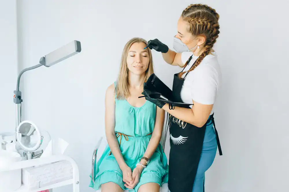 A specialist carefully working on a client's lashes